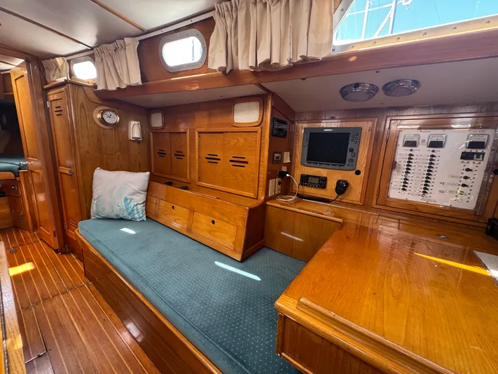 Mast Transit Yacht Photos Pics Interior of 1983 Hinckley Sou'wester 42 sailboat with wood paneling and navigation equipment.