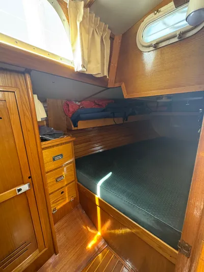 Mast Transit Yacht Photos Pics Cozy cabin interior of 1983 Hinckley Sou'wester 42 sailboat with wooden furnishings.