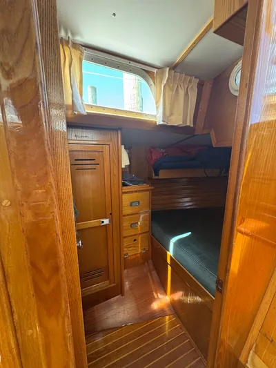 Mast Transit Yacht Photos Pics Cozy cabin interior of 1983 Hinckley Sou'wester 42 sailboat with wooden furnishings.