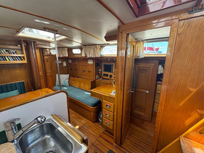 Mast Transit Yacht Photos Pics Interior of 1983 Hinckley Sou'wester 42 sailboat with wood finish and cozy seating area.