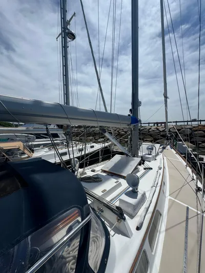 Mast Transit Yacht Photos Pics 1983 Hinckley Sou'wester 42 sailboat docked under a cloudy sky.