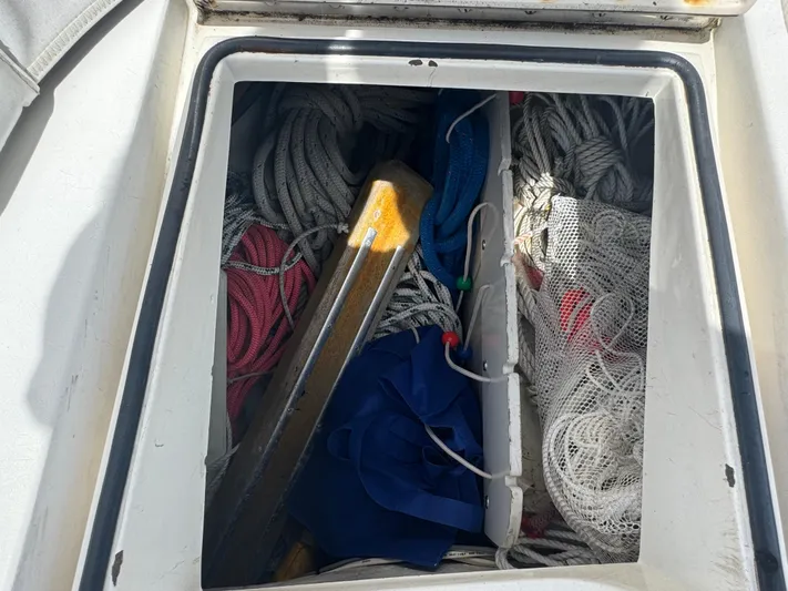Mast Transit Yacht Photos Pics Storage compartment on 1983 Hinckley Sou'wester 42 sailboat, filled with ropes and gear.