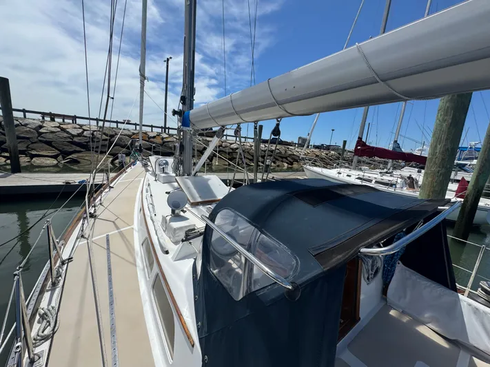 Mast Transit Yacht Photos Pics 1983 Hinckley Sou'wester 42 sailboat docked at marina, clear sky, calm water.