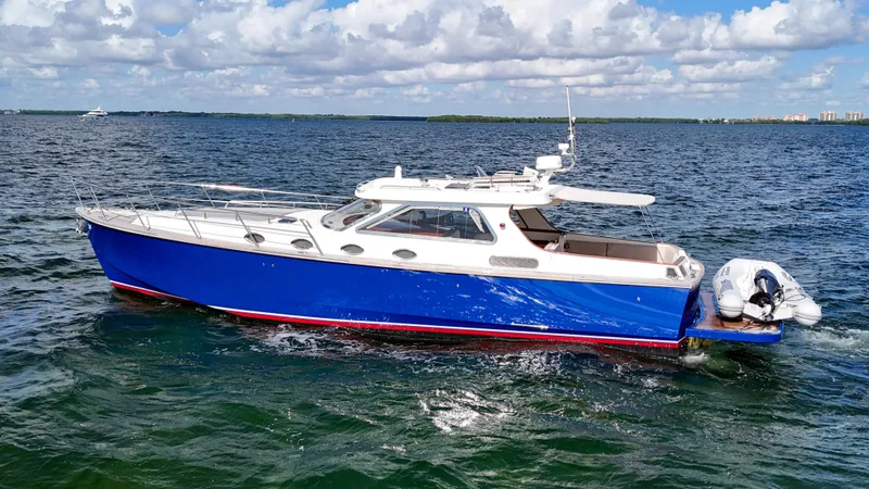  Yacht Photos Pics 2010 Revival 45 Gentlemans yacht with blue hull cruising on open water.