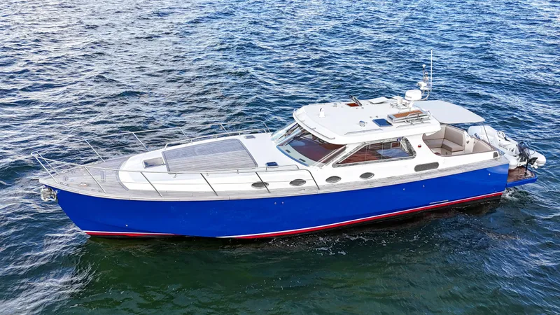  Yacht Photos Pics A 2010 Revival 45 Gentlemans yacht with a sleek blue hull on open water.