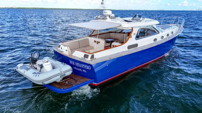  Yacht Photos Pics Revival 45 Gentlemans yacht, 2010 model, cruising on open water with attached dinghy.