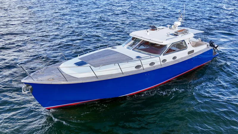  Yacht Photos Pics Revival 45 Gentlemans 2010 boat with blue hull cruising on open water.