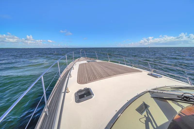  Yacht Photos Pics Bow view of 2010 Revival 45 Gentlemans yacht cruising on open sea under clear blue sky.