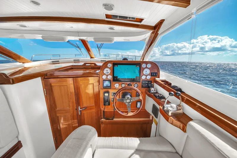  Yacht Photos Pics Luxurious 2010 Revival 45 Gentlemans yacht interior with ocean view and wooden dashboard.