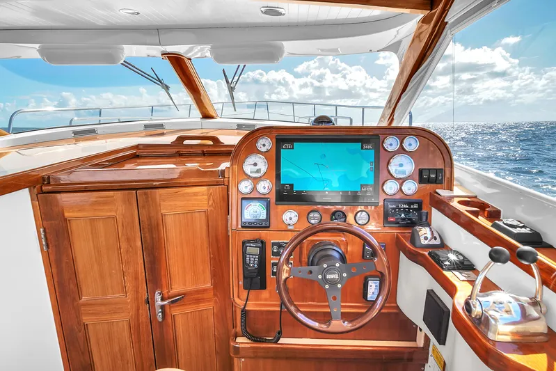  Yacht Photos Pics Cockpit of 2010 Revival 45 Gentlemans yacht with wooden dashboard and navigation equipment.