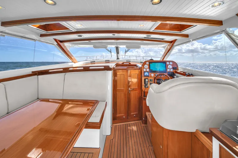  Yacht Photos Pics Luxurious 2010 Revival 45 Gentlemans yacht interior with elegant wood finish and ocean view.