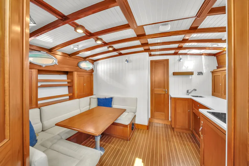  Yacht Photos Pics Luxurious interior of 2010 Revival 45 Gentlemans yacht with wooden finish and cozy seating area.