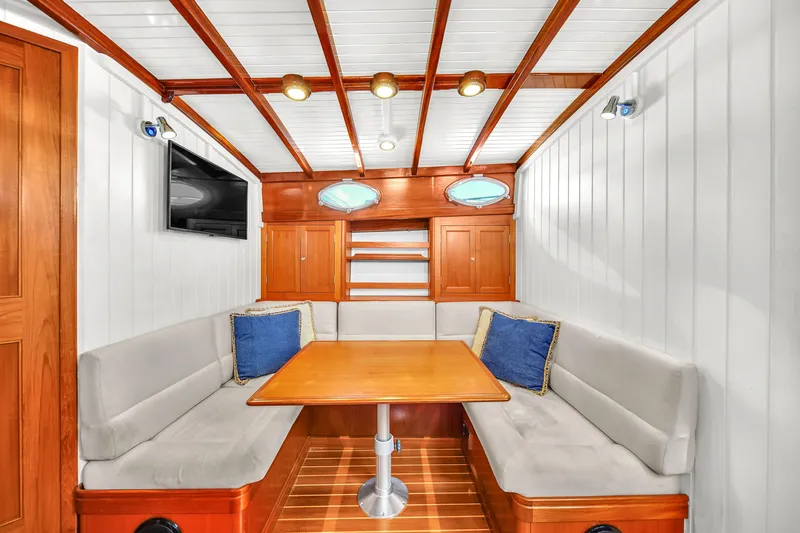  Yacht Photos Pics Luxurious interior of 2010 Revival 45 Gentlemans yacht with wood accents and cozy seating.