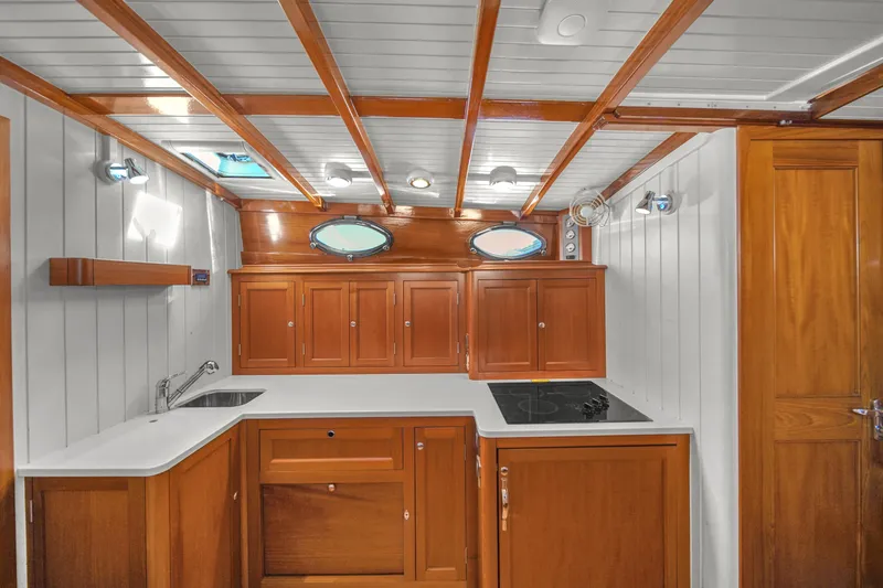  Yacht Photos Pics Elegant wooden interior of 2010 Revival 45 Gentlemans yacht kitchen with modern amenities.