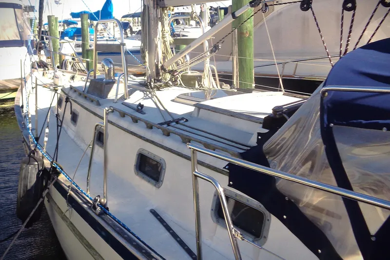  Yacht Photos Pics 1992 Pacific Seacraft 34 sailboat docked, featuring sleek design and sturdy railings.