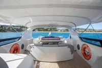 Luxurious 2009 Maiora 31 yacht deck with seating, ocean view, and safety equipment.