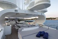 Luxurious 2009 Maiora 31 yacht deck with seating and ocean view.