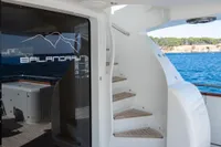 Luxury yacht deck with spiral staircase, Maiora 31, 2009 model, overlooking serene ocean view.