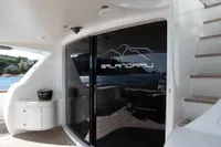 Luxurious Maiora 31 yacht interior with sleek design, featuring stairs and glass doors, 2009 model.
