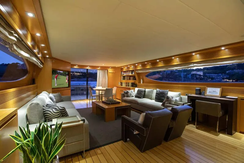  Yacht Photos Pics Luxurious interior of 2009 Maiora 31 yacht with elegant seating and ambient lighting.