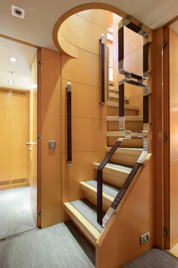  Yacht Photos Pics Luxurious wooden staircase inside 2009 Maiora 31 yacht, featuring modern design and elegant finishes.