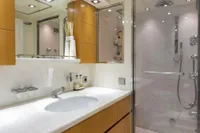Luxurious bathroom on 2009 Maiora 31 yacht with modern fixtures and glass shower.