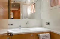 Luxurious bathroom in a 2009 Maiora 31 yacht, featuring modern fixtures and elegant design.