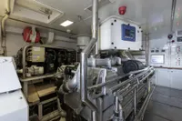 Engine room of 2009 Maiora 31 yacht, featuring advanced machinery and control panels.