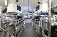 Engine room of 2009 Maiora 31 yacht, featuring advanced control panels and machinery.