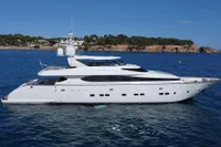 Luxurious 2009 Maiora 31 yacht cruising on serene blue waters.