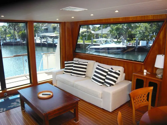 Vitamin Sea Yacht Photos Pics Luxurious interior of 1990 Viking Cockpit Motor Yacht with waterfront view and elegant furnishings.