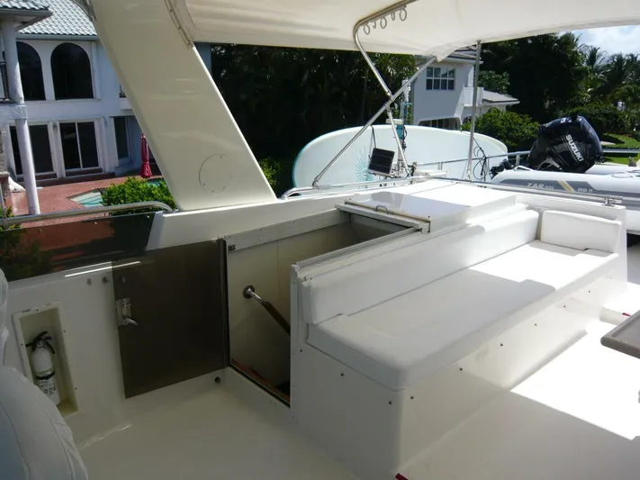 Vitamin Sea Yacht Photos Pics 1990 Viking Cockpit Motor Yacht interior with white seating and outdoor view.