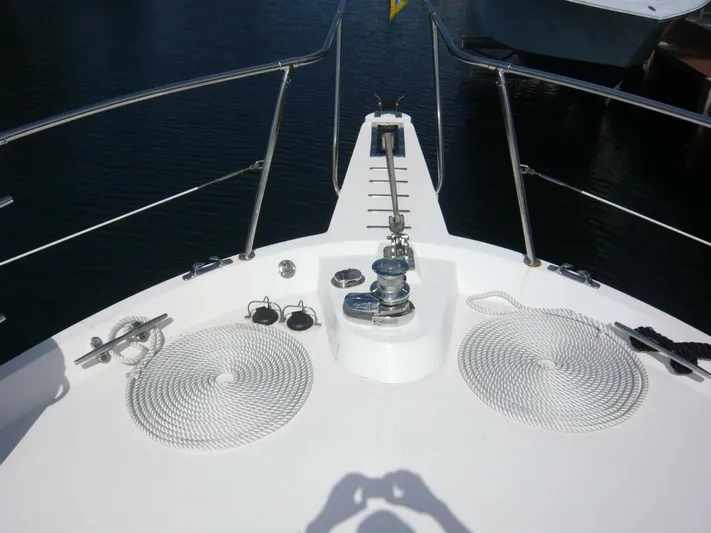 Vitamin Sea Yacht Photos Pics Bow of 1990 Viking Cockpit Motor Yacht with ropes and anchor equipment.