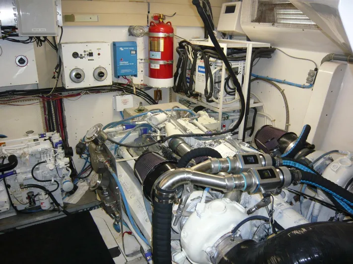 Vitamin Sea Yacht Photos Pics Engine room of a 1990 Viking Cockpit Motor Yacht with visible machinery and equipment.