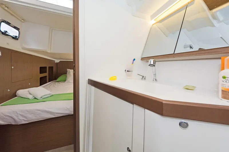  Yacht Photos Pics Interior of 2020 Beneteau Oceanis 46.1 yacht, featuring a cozy cabin and modern bathroom.