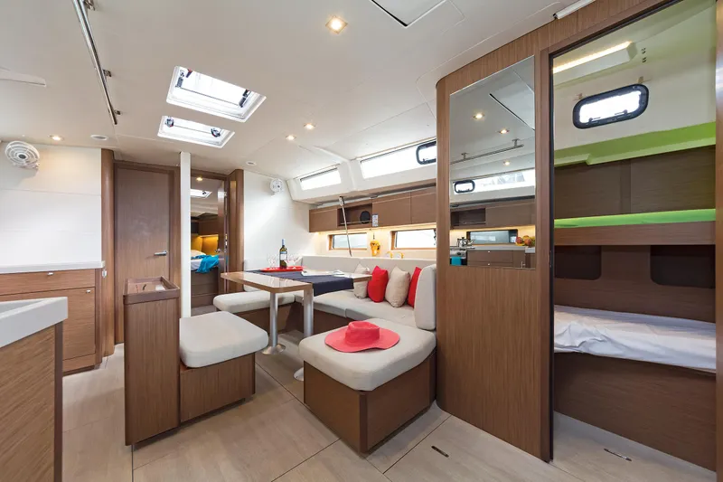  Yacht Photos Pics Luxurious interior of 2020 Beneteau Oceanis 46.1 yacht with modern seating and dining area.