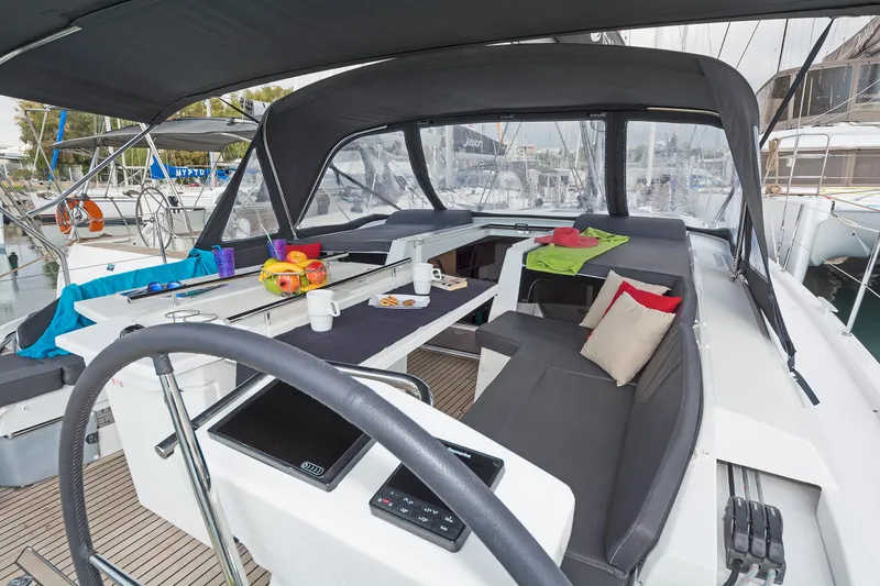 Yacht Photos Pics Cockpit of 2020 Beneteau Oceanis 46.1 yacht with seating and table setup.