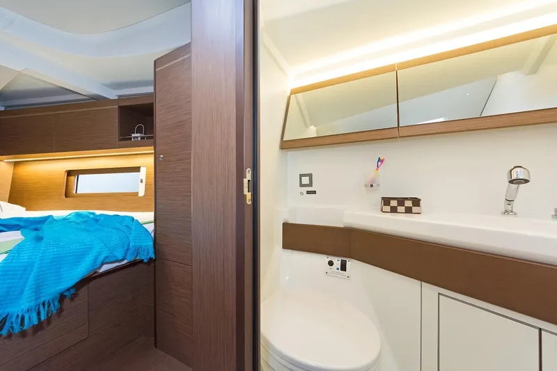  Yacht Photos Pics Interior of 2020 Beneteau Oceanis 46.1 yacht, featuring a modern bathroom and cozy bedroom.