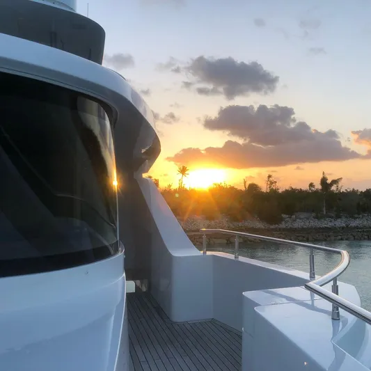  Yacht Photos Pics Majesty 140 yacht at sunset, 2026 model, with scenic ocean view.