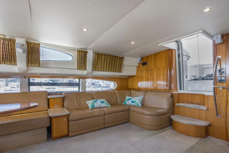 Lemonade Yacht Photos Pics Interior of 2001 Carver 466 Motor Yacht with beige leather seating and wooden accents.