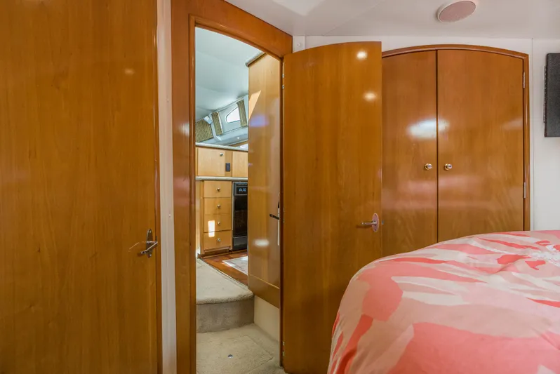Lemonade Yacht Photos Pics Interior of 2001 Carver 466 Motor Yacht with wooden doors and cozy bedroom.