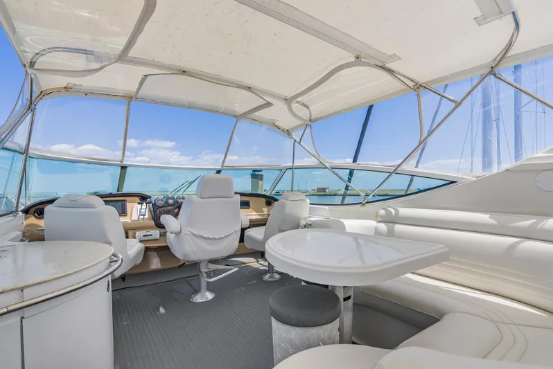 Lemonade Yacht Photos Pics Luxurious interior of 2001 Carver 466 Motor Yacht with helm and seating area.