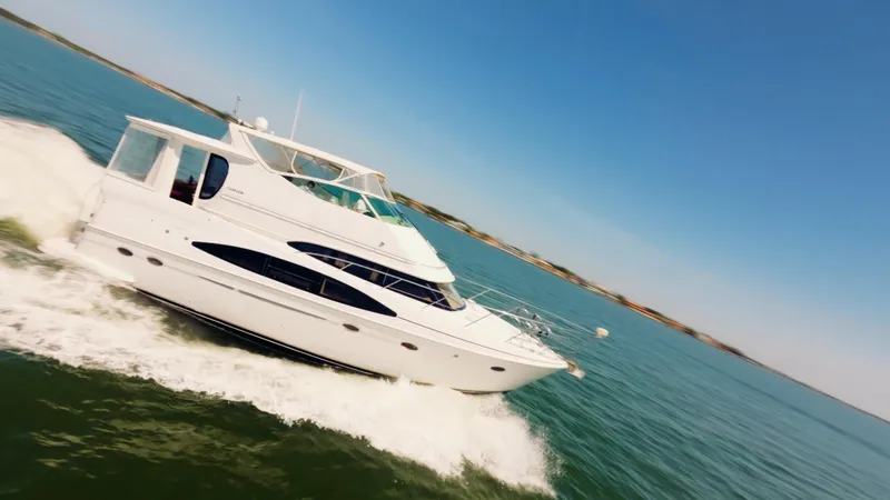 Lemonade Yacht Photos Pics 2001 Carver 466 Motor Yacht cruising on open water under clear blue skies.