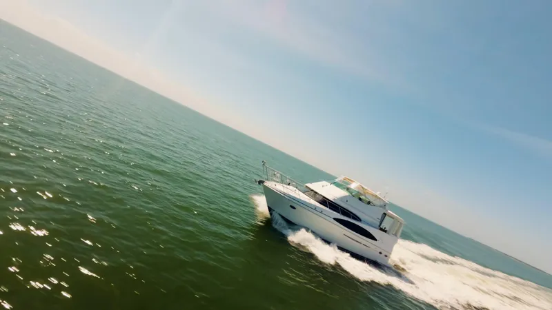 Lemonade Yacht Photos Pics 2001 Carver 466 Motor Yacht cruising on open water under clear skies.