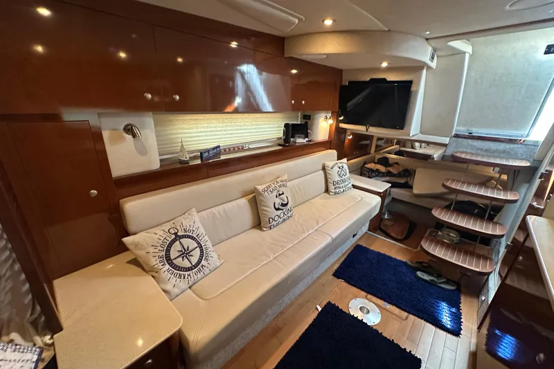  Yacht Photos Pics Luxurious interior of 2009 Sea Ray 350 Sundancer yacht with plush seating and modern amenities.
