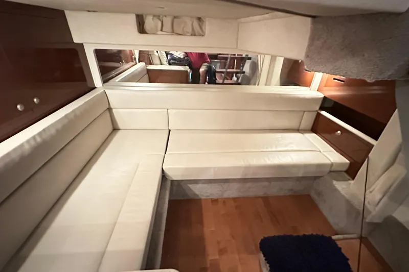  Yacht Photos Pics Interior of 2009 Sea Ray 350 Sundancer with cream seating and wooden accents.