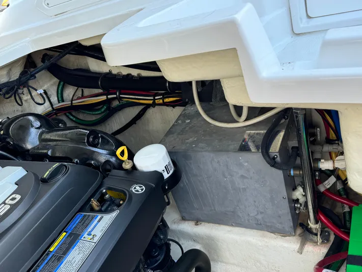Amoore Yacht Photos Pics Engine compartment of a 2018 Monterey 328 Super Sport boat, showing mechanical components and wiring.