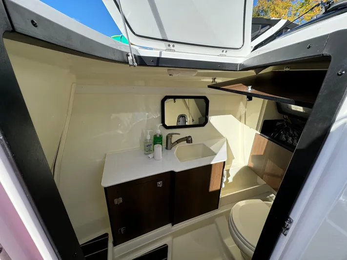 Amoore Yacht Photos Pics Interior of 2018 Monterey 328 Super Sport boat bathroom with sink and toilet.