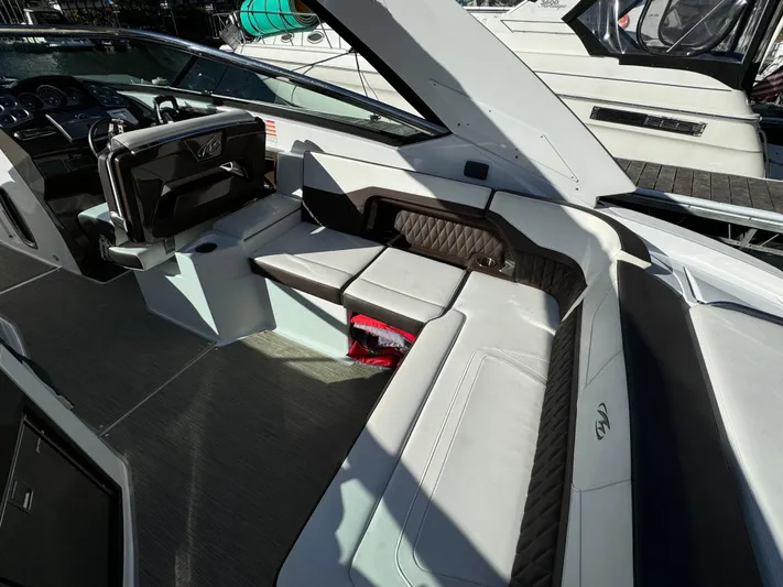 Amoore Yacht Photos Pics 2018 Monterey 328 Super Sport boat interior with luxurious seating and modern dashboard.