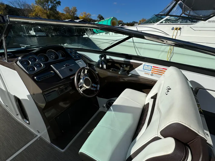 Amoore Yacht Photos Pics 2018 Monterey 328 Super Sport boat interior with steering wheel and dashboard.